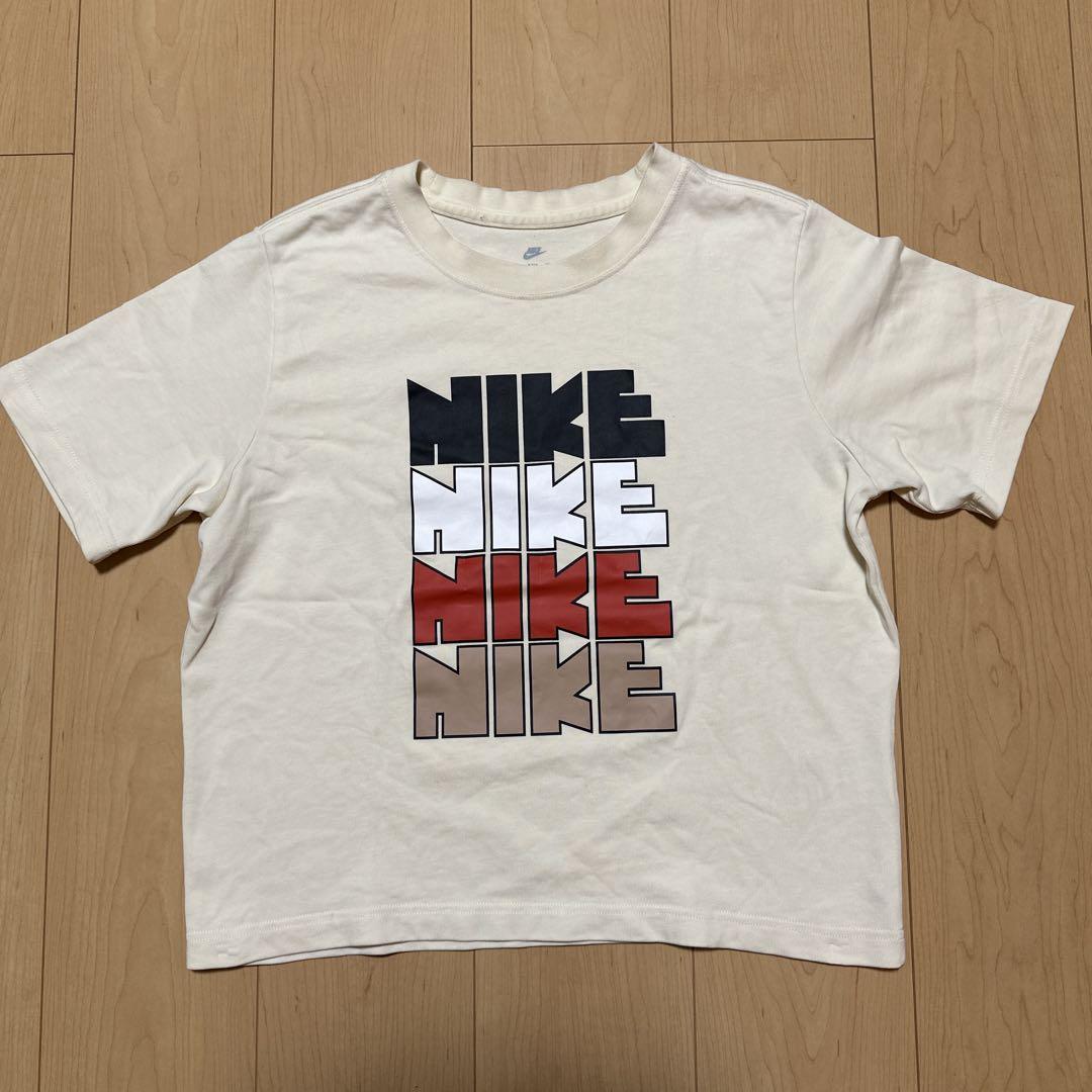 4連ゴツナイキNike ロゴプリント Tシャツ クリーム色160Mルーズフィット