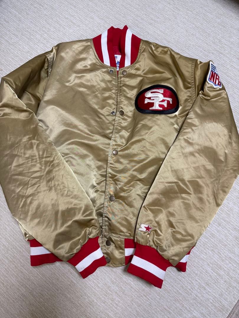サンフランシスコ49ers ゴールドスタジャン - メルカリ サンフランシスコ49ers ゴールドスタジャン - メルカリ