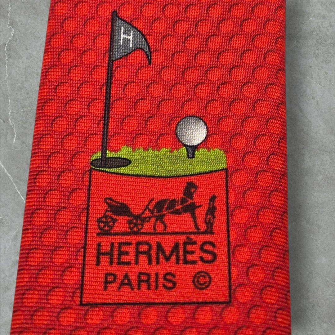 HERMES オレンジ 赤系 ゴルフモチーフ ネクタイ