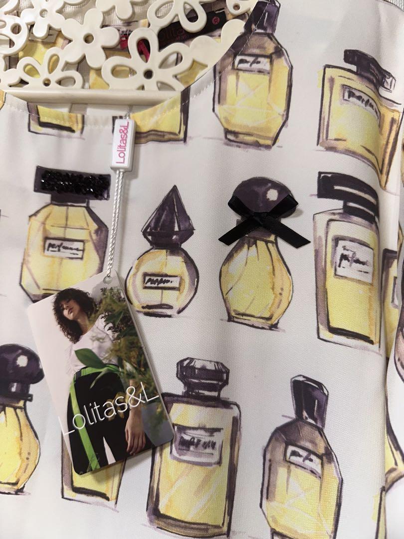 新品タグ付イタリア製Lolita は香水ボトルプリントワンピース白色ベースに黄色