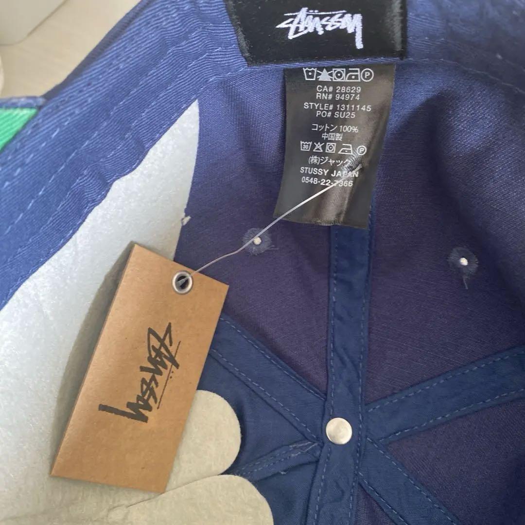 Stussy ネイビー スナップバックキャップ