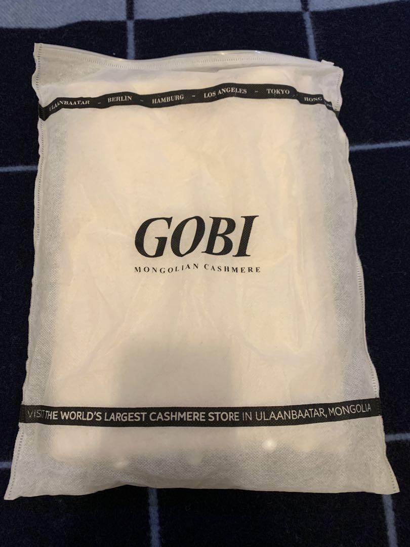 新品未使用レーディスポンチョ ニットカシミヤ 100 白モンゴル産GOYOボタン 新品未使用レーディスポンチョ ニットカシミヤ 100 白モンゴル産