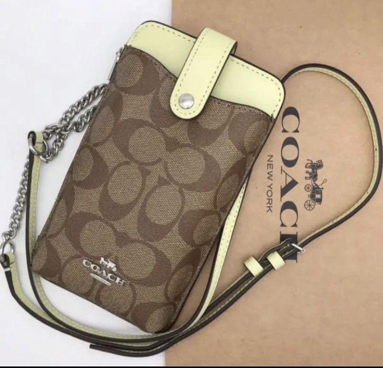 COACHコーチ ノース／サウス フォーンクロスボディ シグネチャー キャンバス