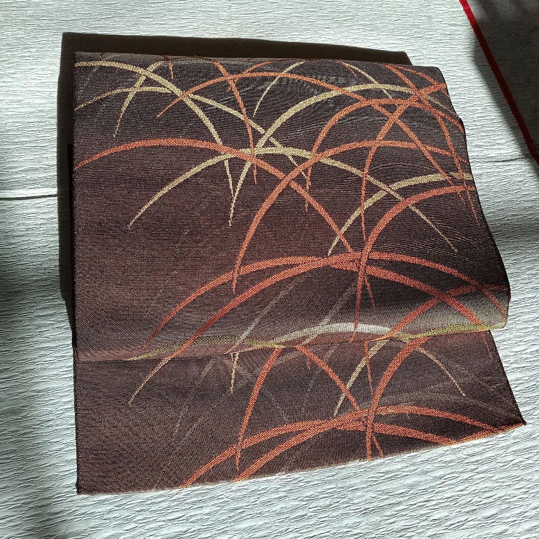 茶色とオレンジの幾何学模様　　 名古屋帯