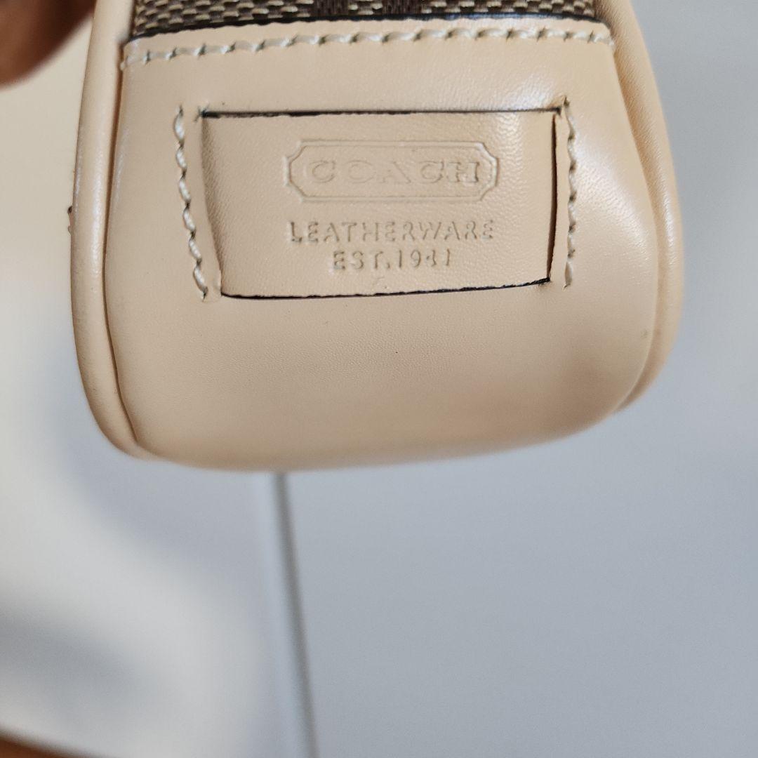 COACH ブラウンロゴ柄バッグ