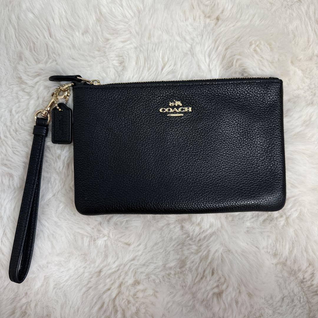 COACH ブラック レザー ポーチ ストラップ付き - メルカリ