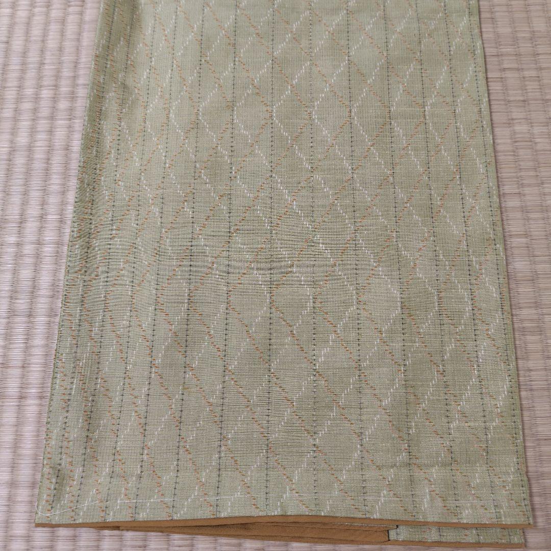 絣風の菱文様の紬地袷着物
