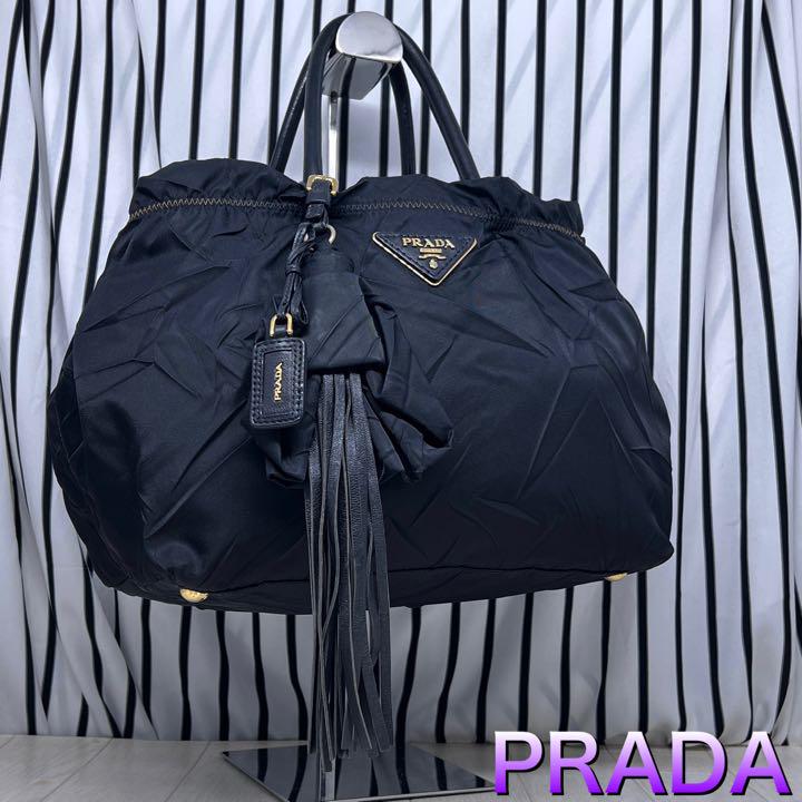 海外ブランド 【美品】PRADA×プラダ A4収納可能金色プレートトート ...