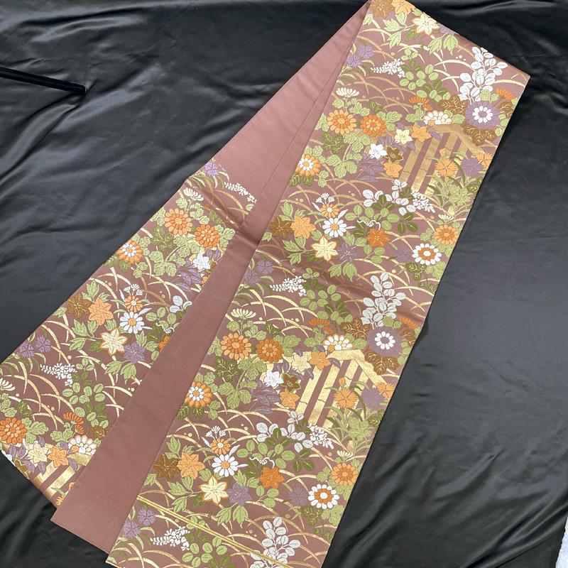 507my33△袋帯 唐織 露芝 菊 桔梗 萩 秋草 金糸 六通 小豆色 △美品