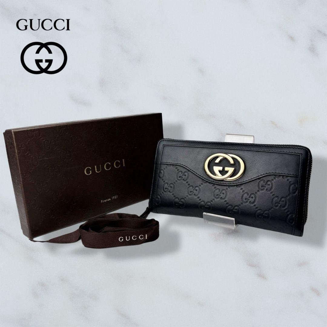 01 GUCCI 長財布 黒 ラウンドファスナー シマ