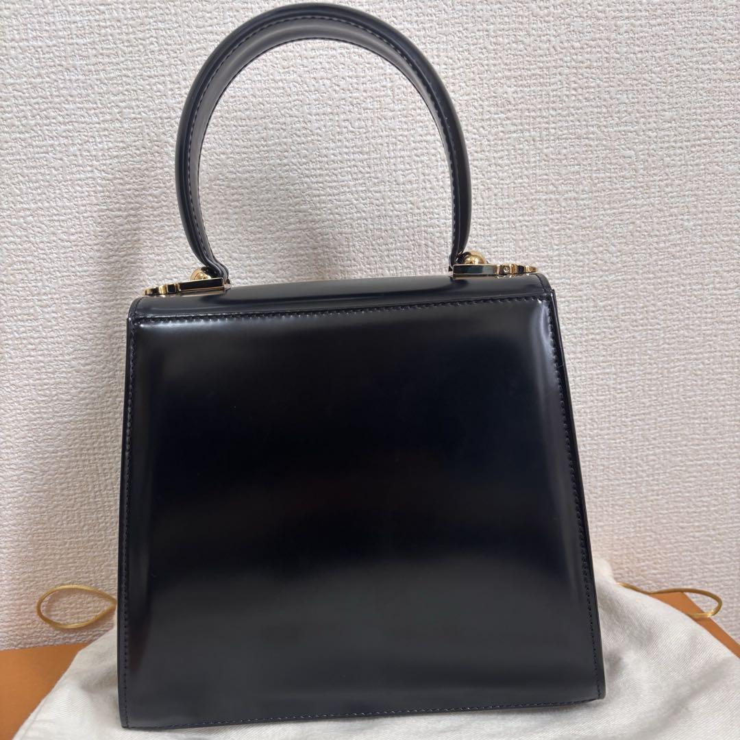 FERRAGAMOアイコニック トップハンドルバッグ - メルカリ