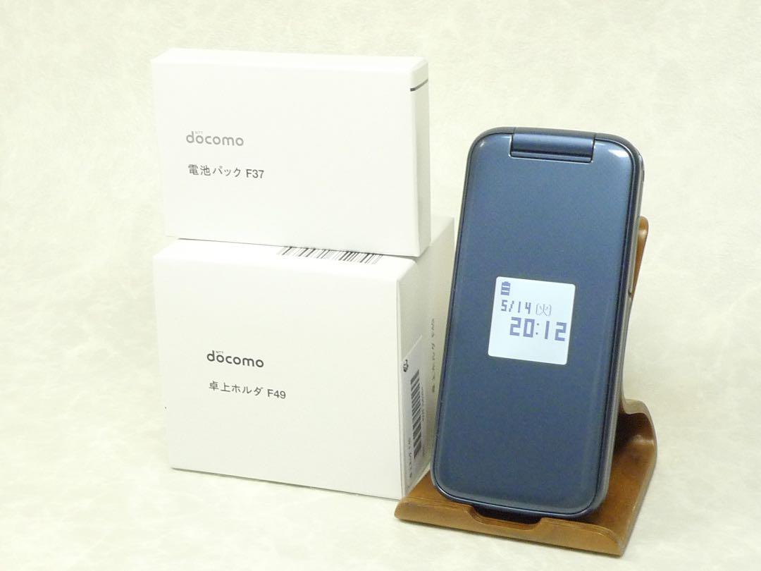 5697【新品同様品/新品電池&卓上ホルダ付き】らくらくホンF-01M ネイビー