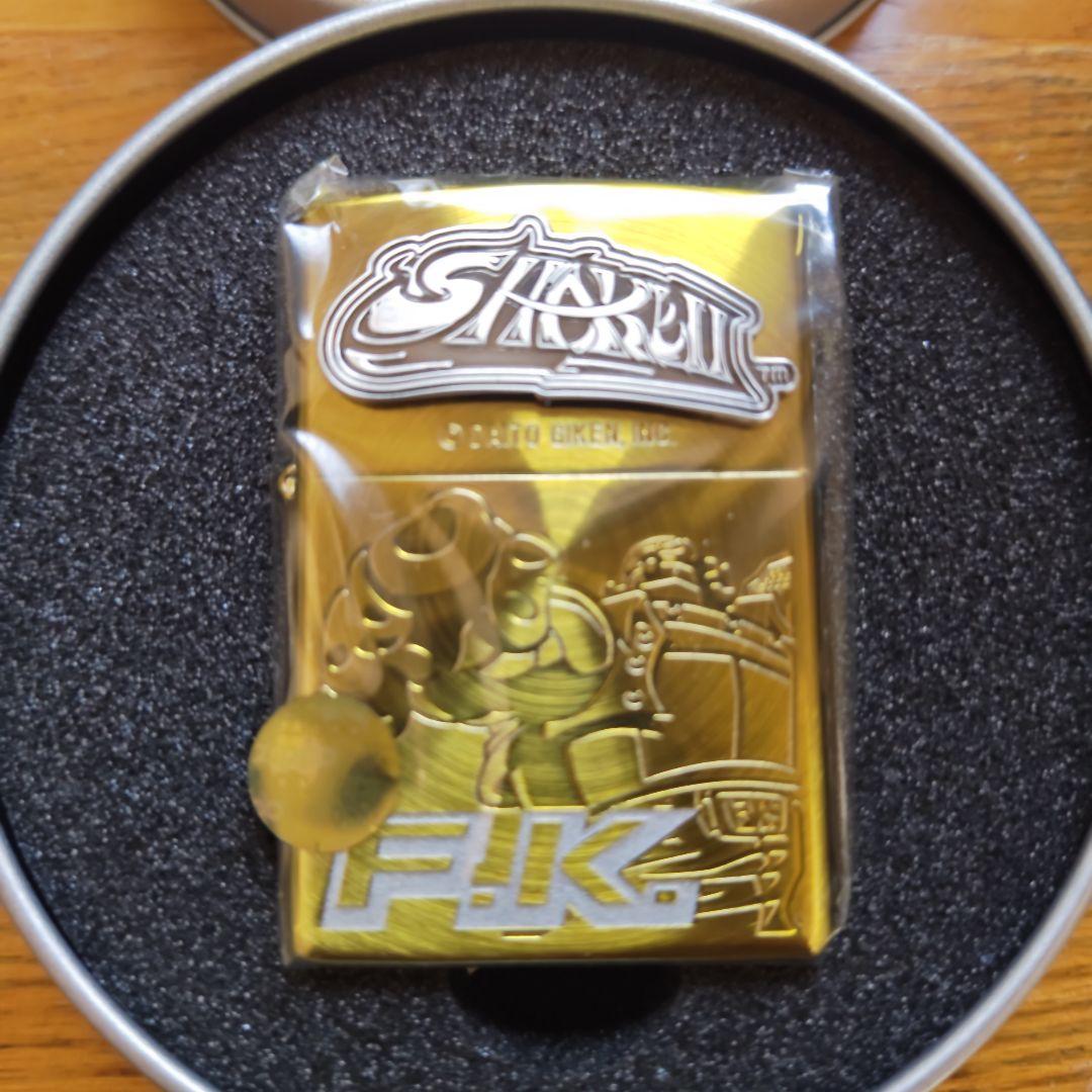 SHARON F.K. ゴールドライター缶ケース付き