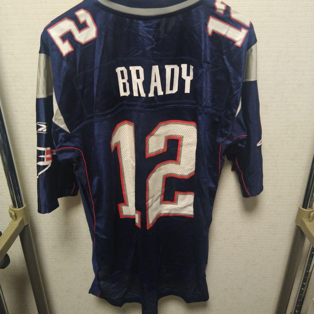 ビンテージ　New England Patriots 12番 ユニフォーム L ビンテージ New England Patriots 12番 ユニフォーム L - メルカリ