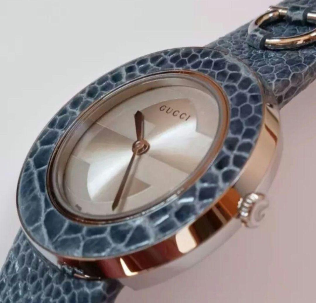 他 GUCCI