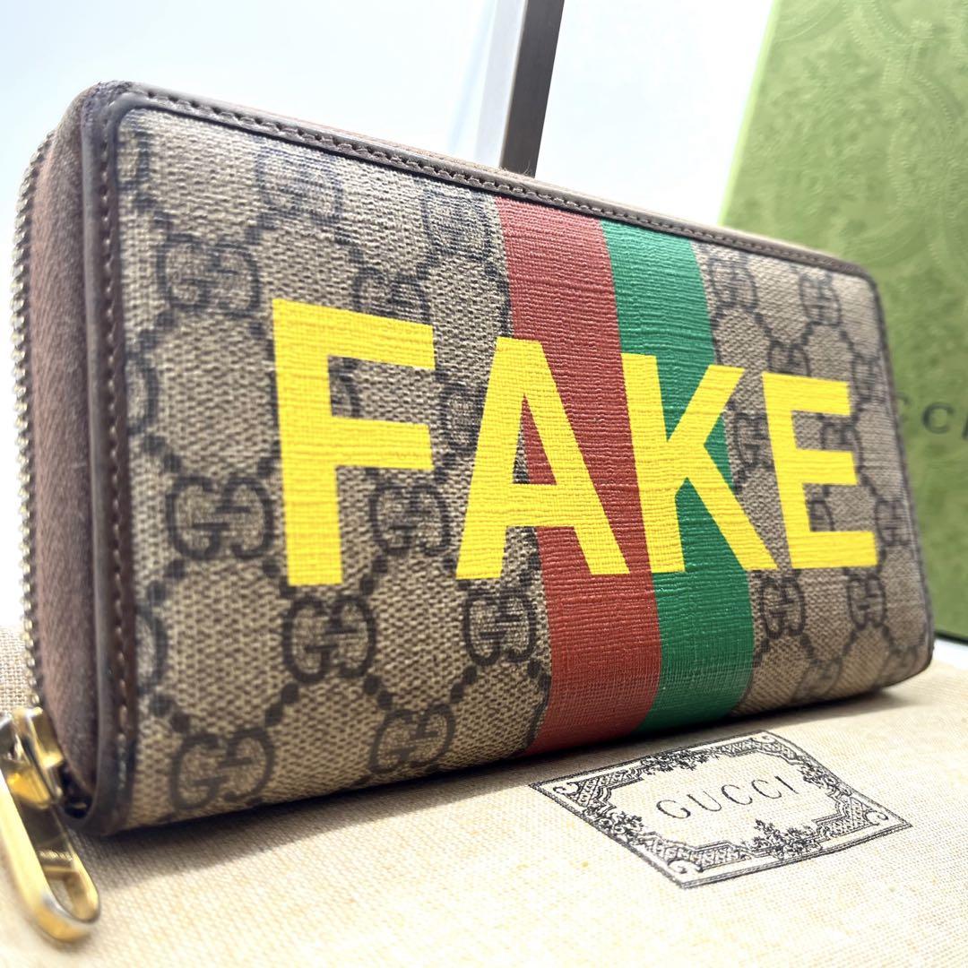 グッチ 長財布 ラウンドファスナー GGスプリーム×レザー FAKE NOT 茶