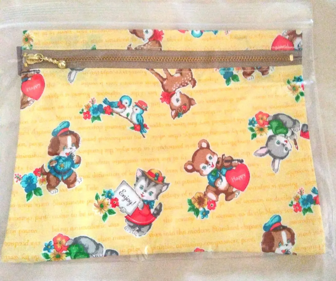 Thumbnail of Handmade pouch by the artist, animal pattern, yellow background