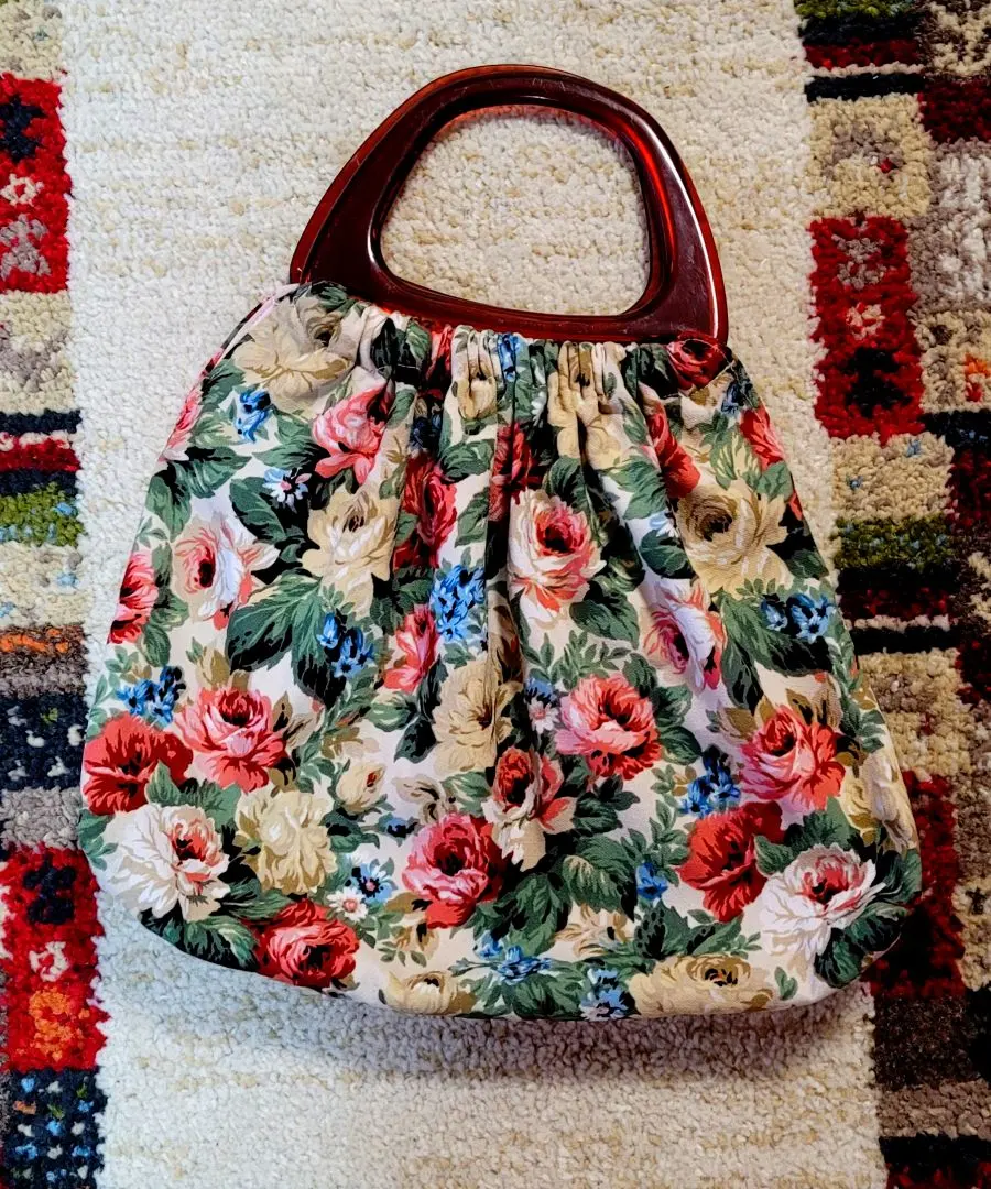 Thumbnail of Handbag with floral pattern, shiny fabric