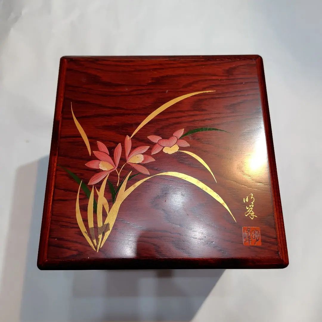 Thumbnail of Wooden three-tiered box with floral gold leaf decoration, Aizu lacquerware