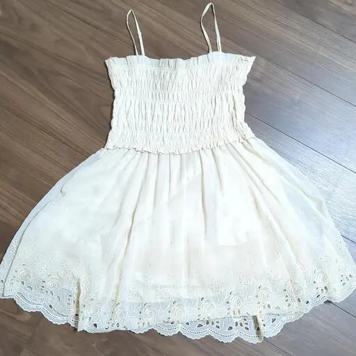 Thumbnail of Cream-colored slip dress with frills