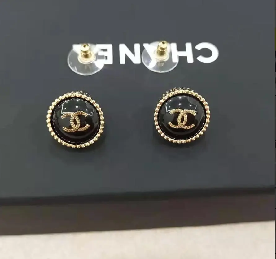 Thumbnail of CHANEL Logo Earrings, Black and Gold