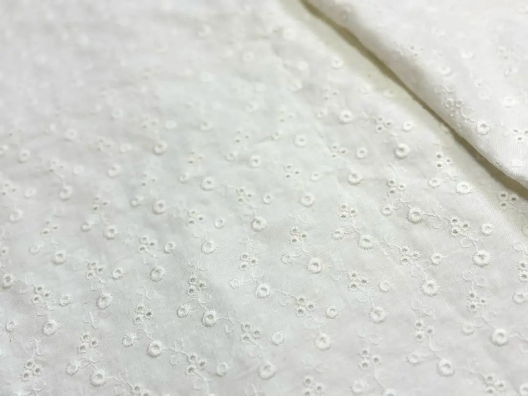 Thumbnail of Off-white lace fabric with floral embroidery and small flowers