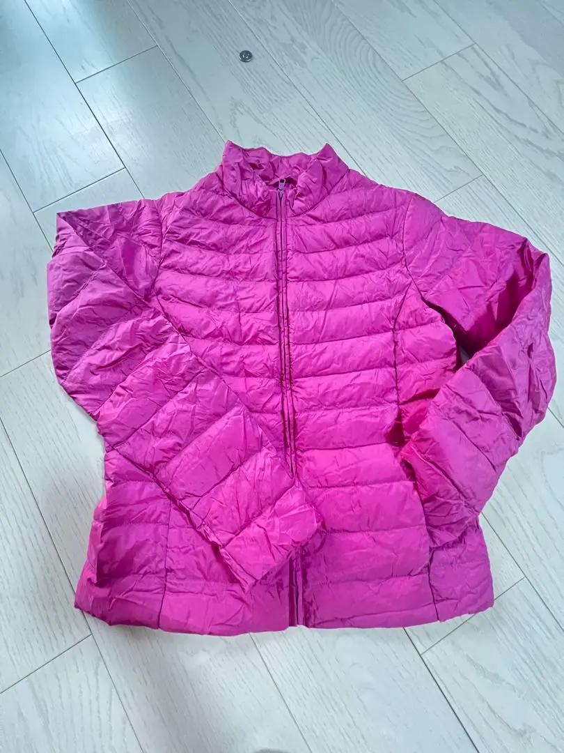 Thumbnail of Uniqlo down jacket, pink, with storage bag