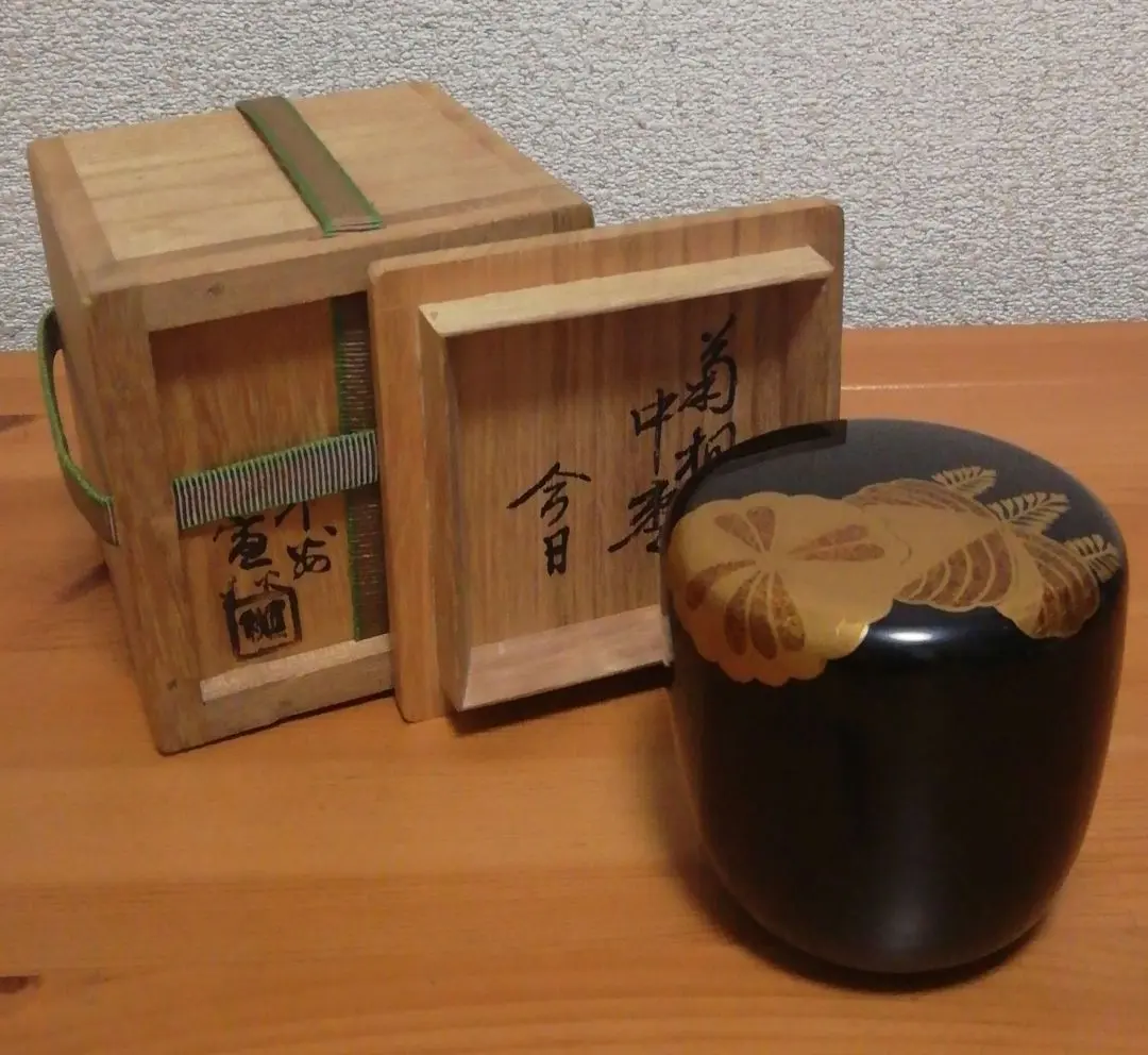 Thumbnail of Natsume (tea caddy) with chrysanthemum and paulownia crest design, inscribed by Tantansai, made by Kanshu, with original box, tea ceremony utensil