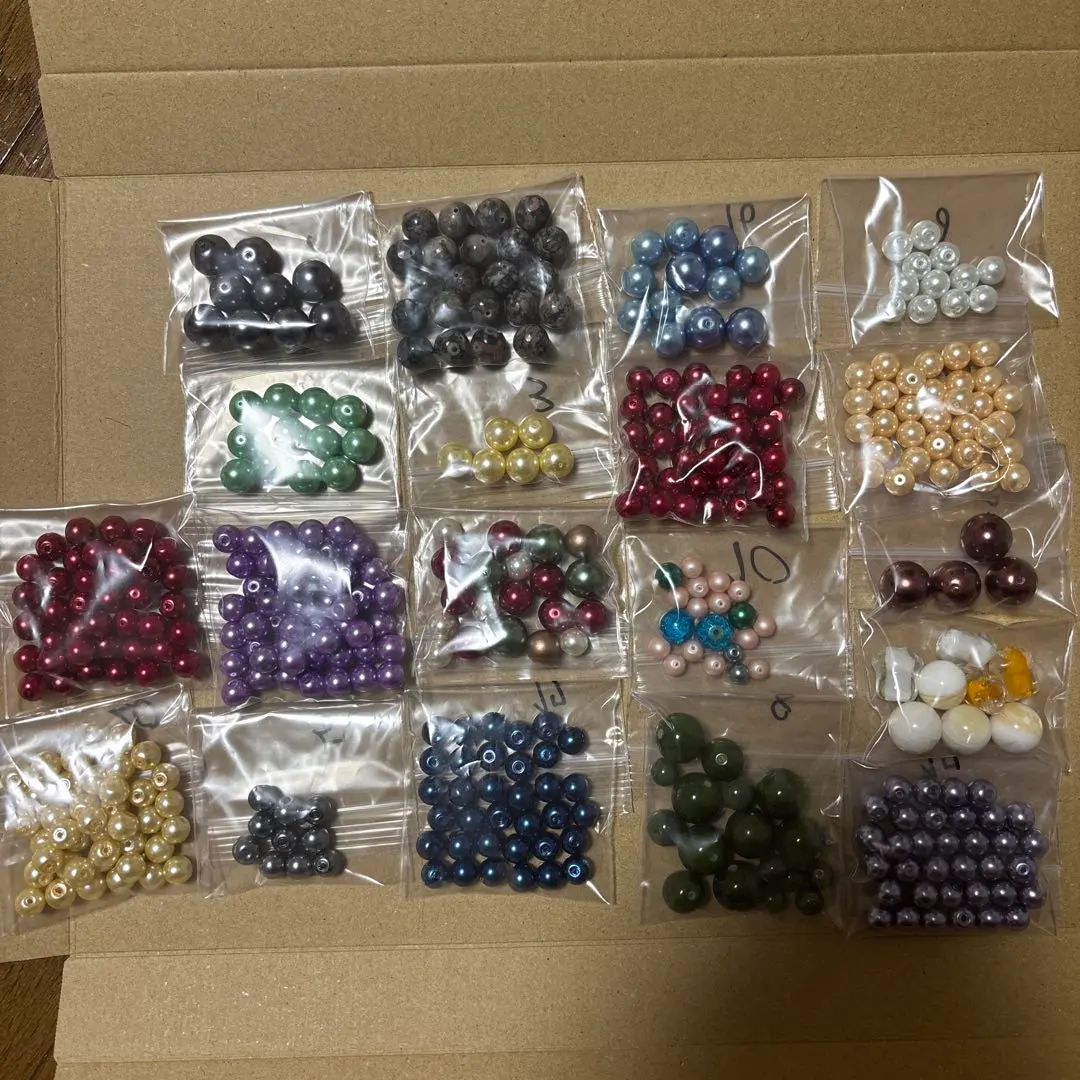 Thumbnail of Glass pearl beads, set of 19 bags