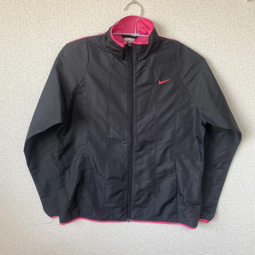 Thumbnail of Excellent condition women's Nike track jacket, size M, black/pink