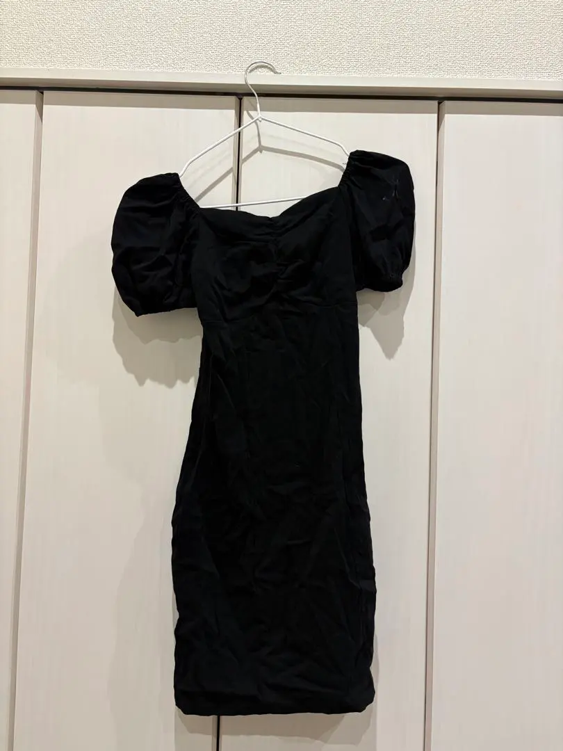 Thumbnail of Black tight-fitting mini dress