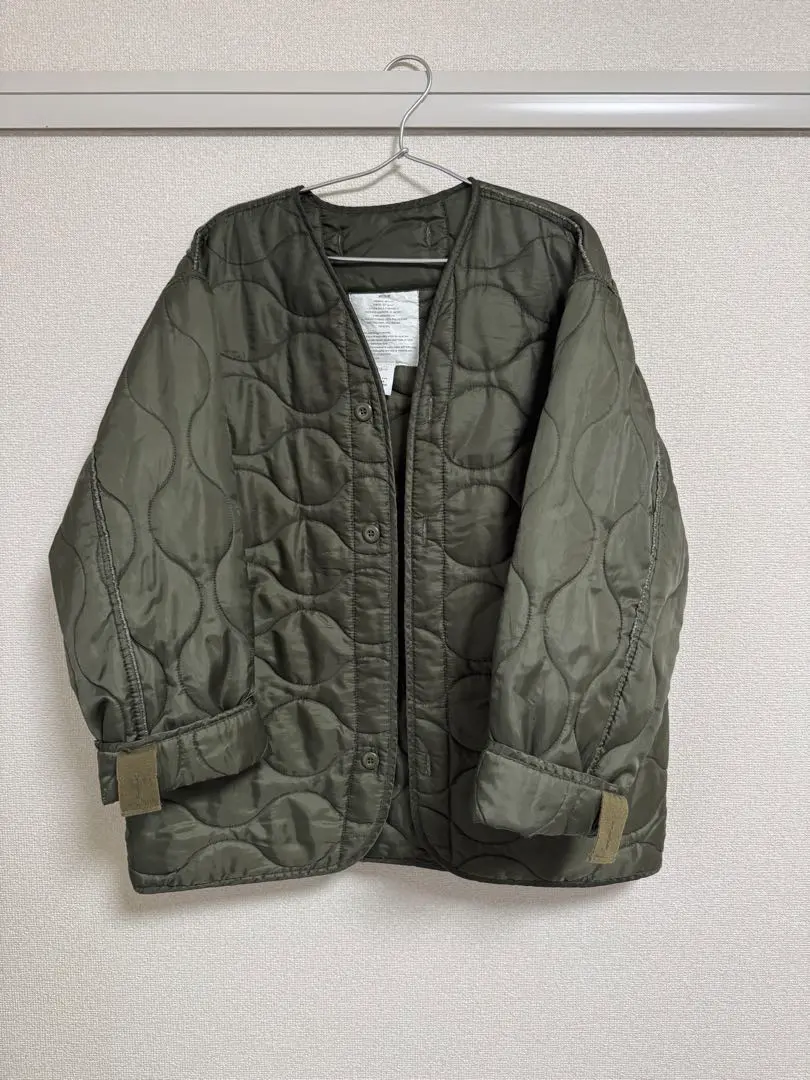 Thumbnail of Olive green quilted jacket
