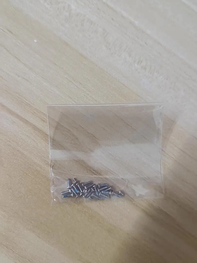 Thumbnail of Approximately 20 metal cylindrical nails