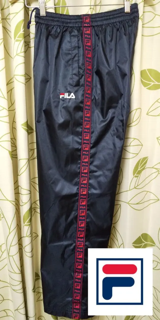 Thumbnail of New Fila M size bottoms nylon pants with mesh lining