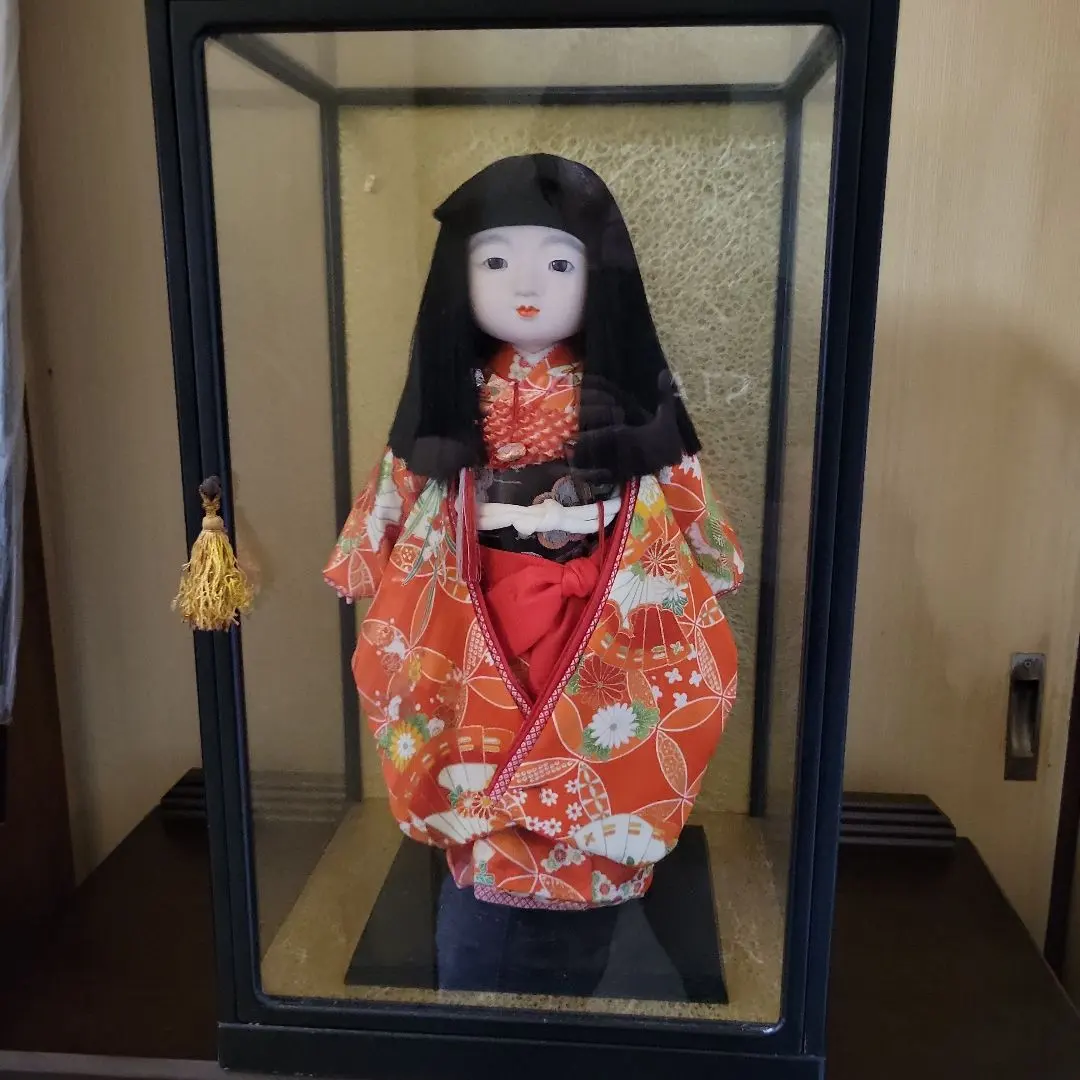 Thumbnail of Ichimatsu doll in orange kimono