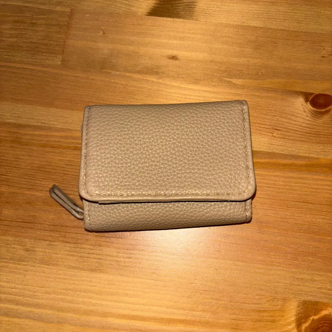 Thumbnail of Beige trifold wallet