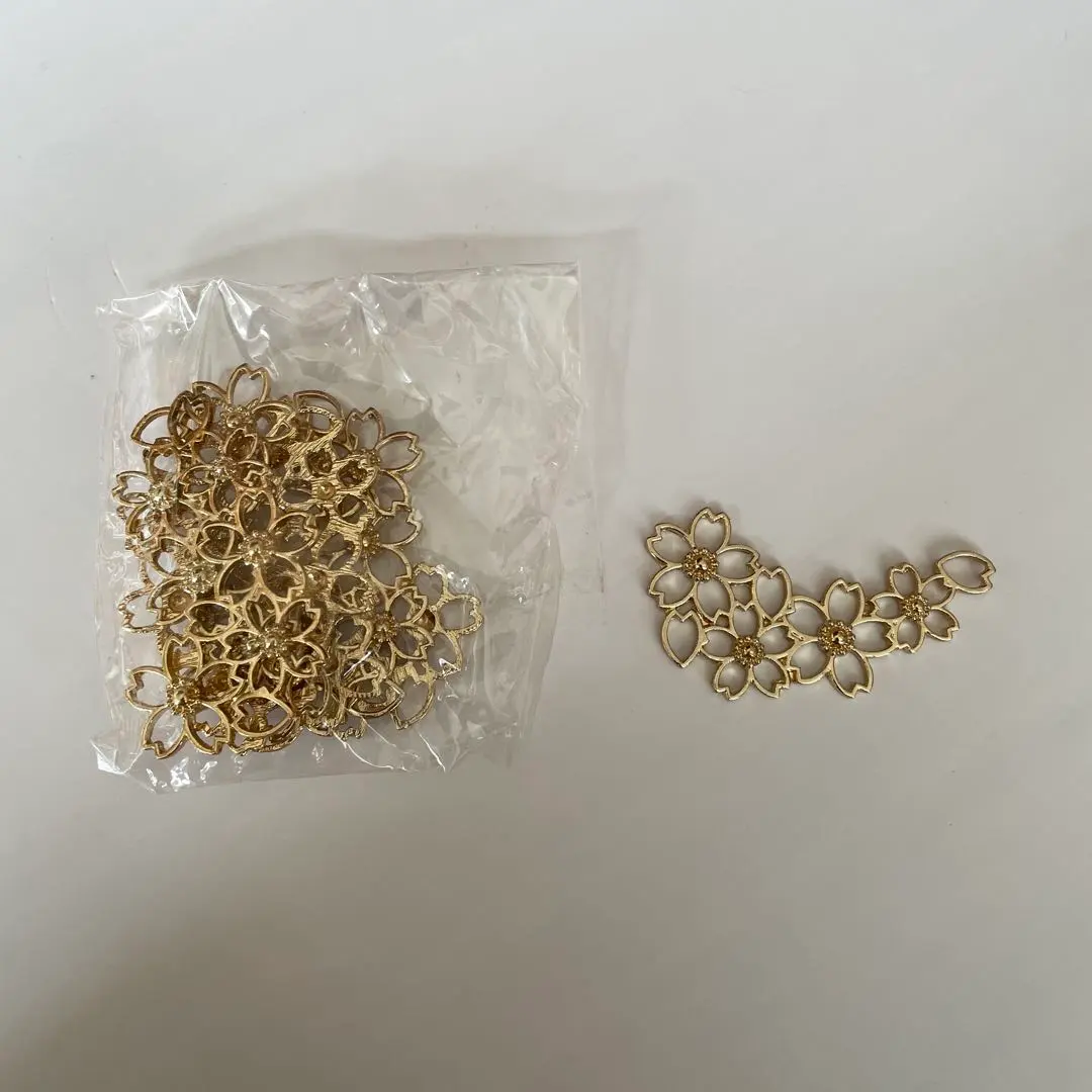 Thumbnail of Gold flower-shaped parts