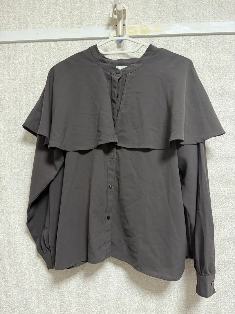 Thumbnail of Gray long-sleeved shirt with frills