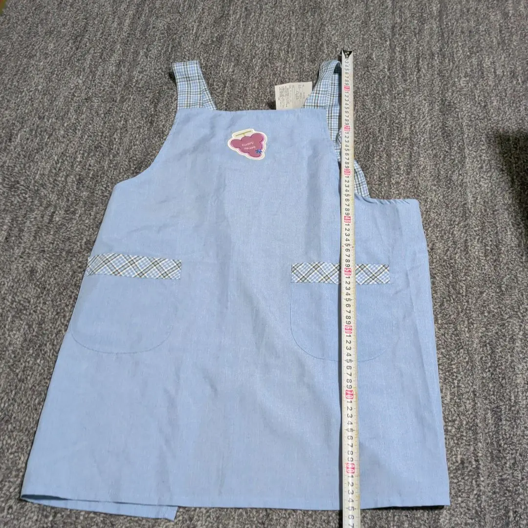 Thumbnail of Light blue apron with checkered straps, shipped anonymously, includes shipping, kitchen
