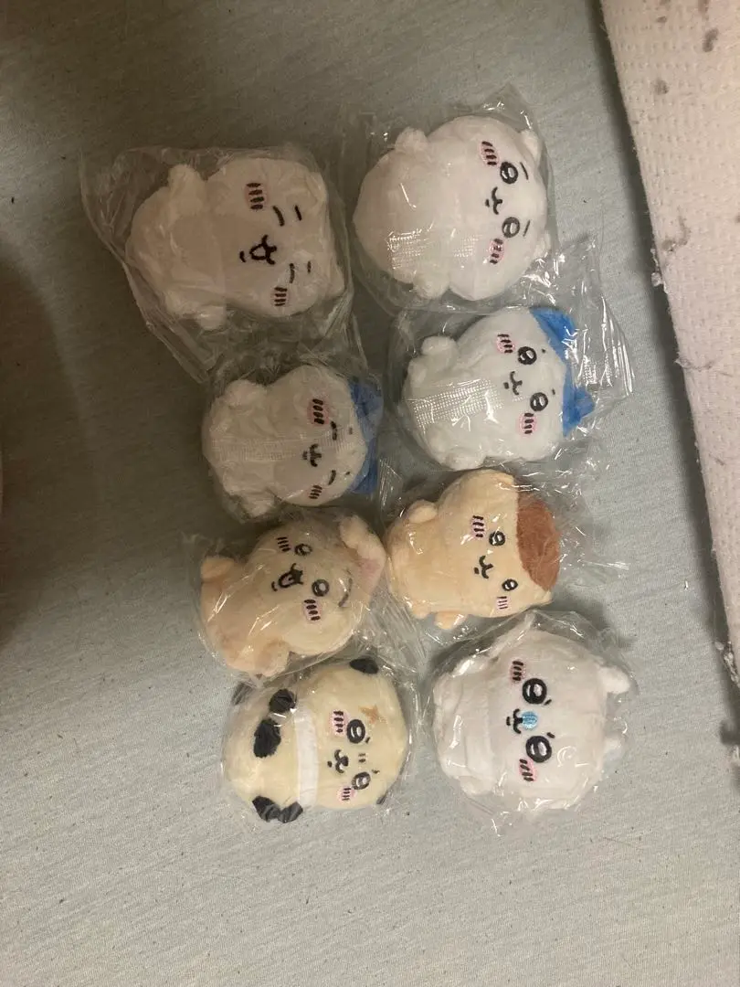 Thumbnail of Set of 8 sitting plushies, 1 and 2.