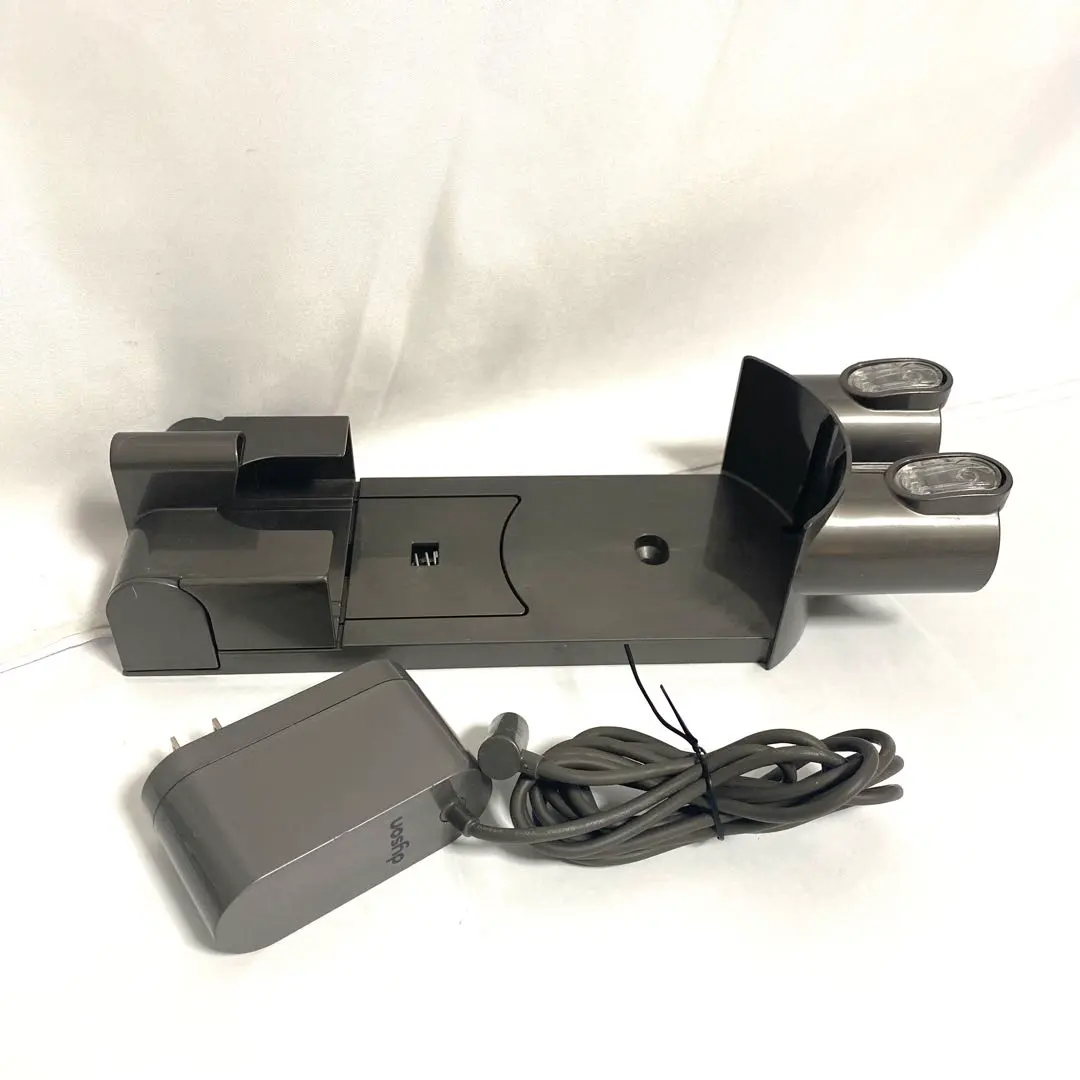 Thumbnail of Dyson storage bracket and charging adapter