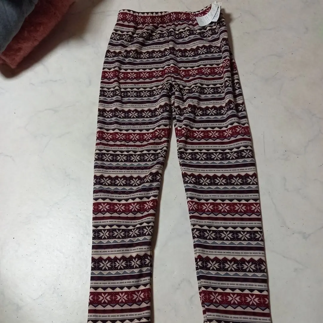 Thumbnail of Multi-colored snowflake pattern, size M, pants