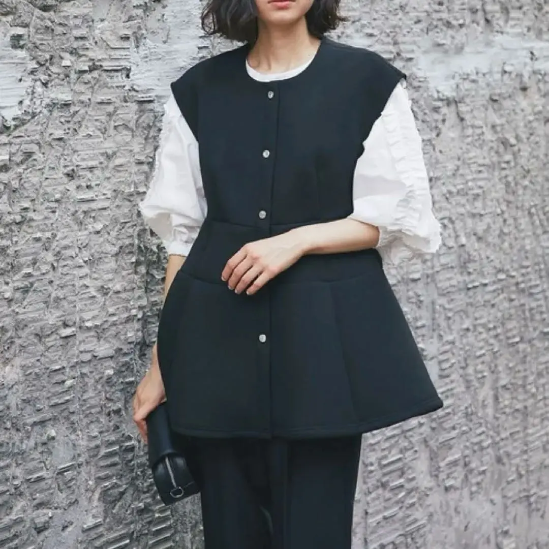 Thumbnail of Excellent condition smile orchid Ponte bonding peplum vest black