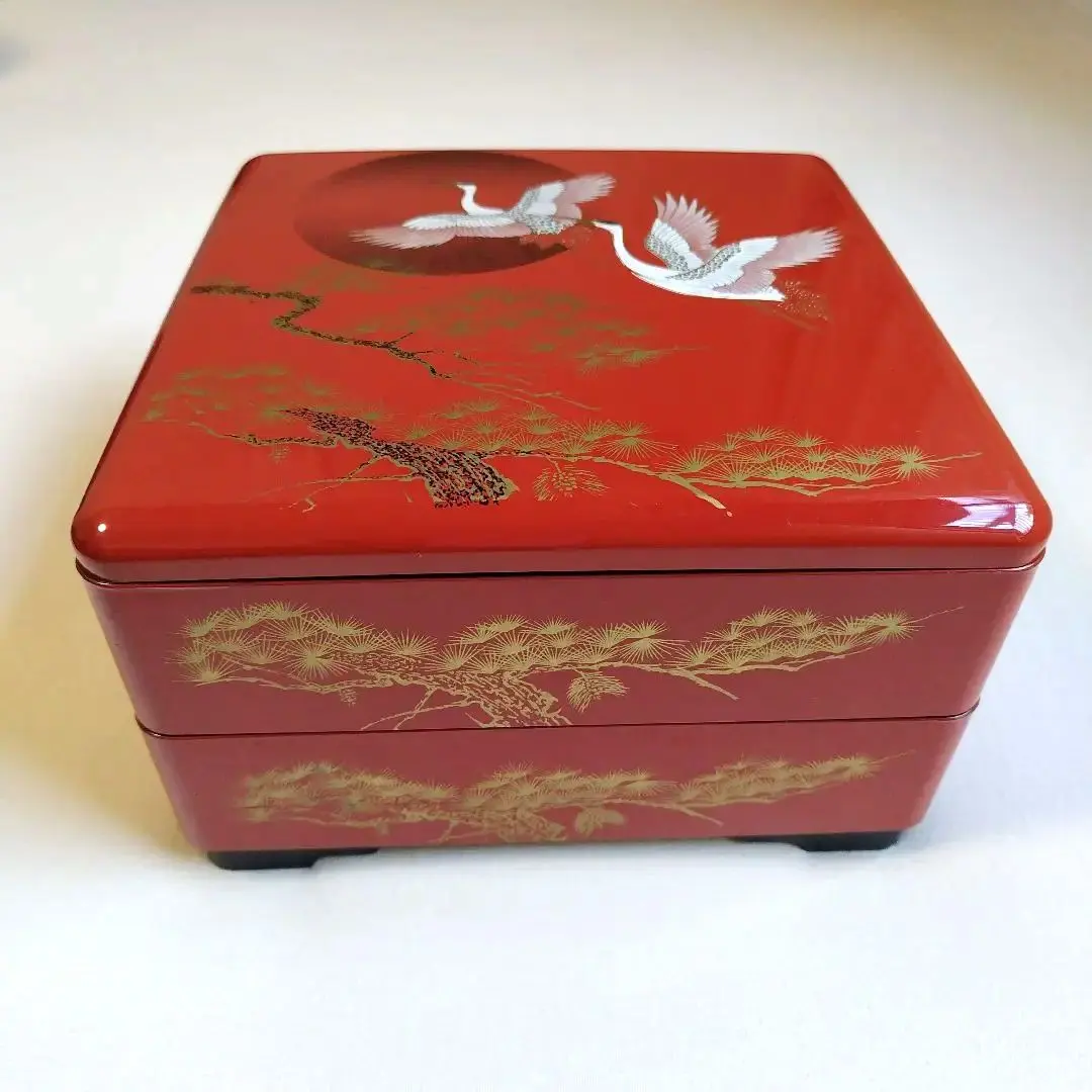 Thumbnail of Red lacquerware jubako (tiered food box) with crane and pine tree design, 2 tiers