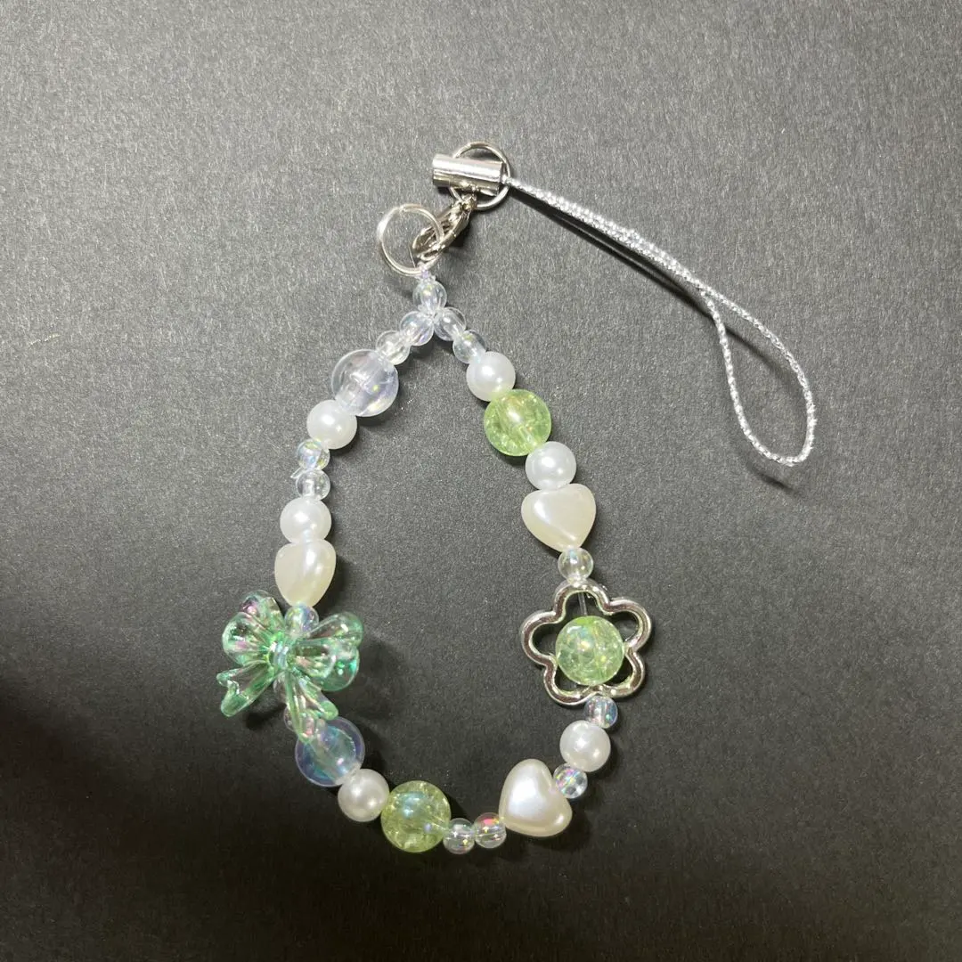 Thumbnail of Handmade flower and butterfly design charm