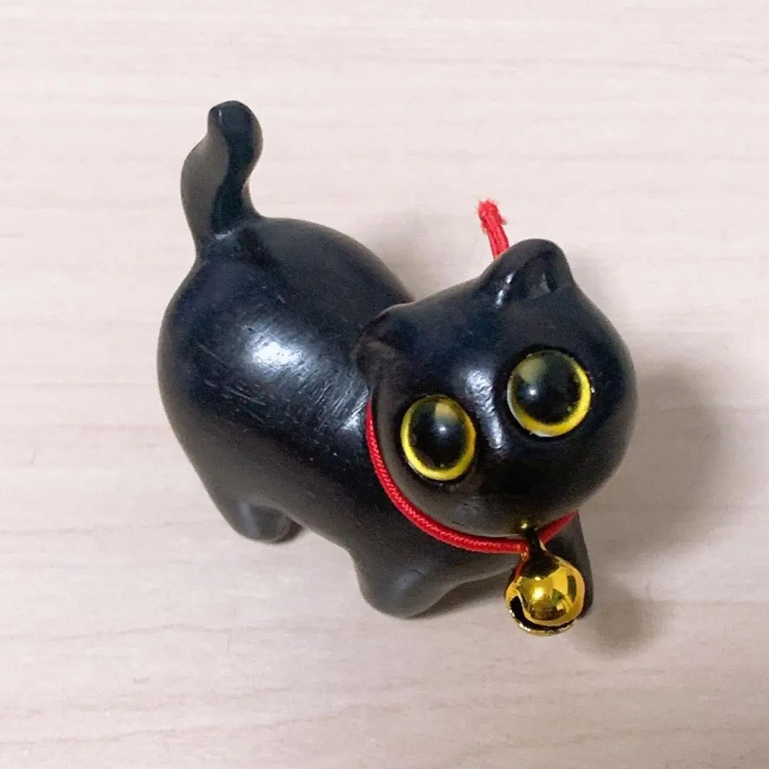 Thumbnail of Wooden black cat figurine with bell