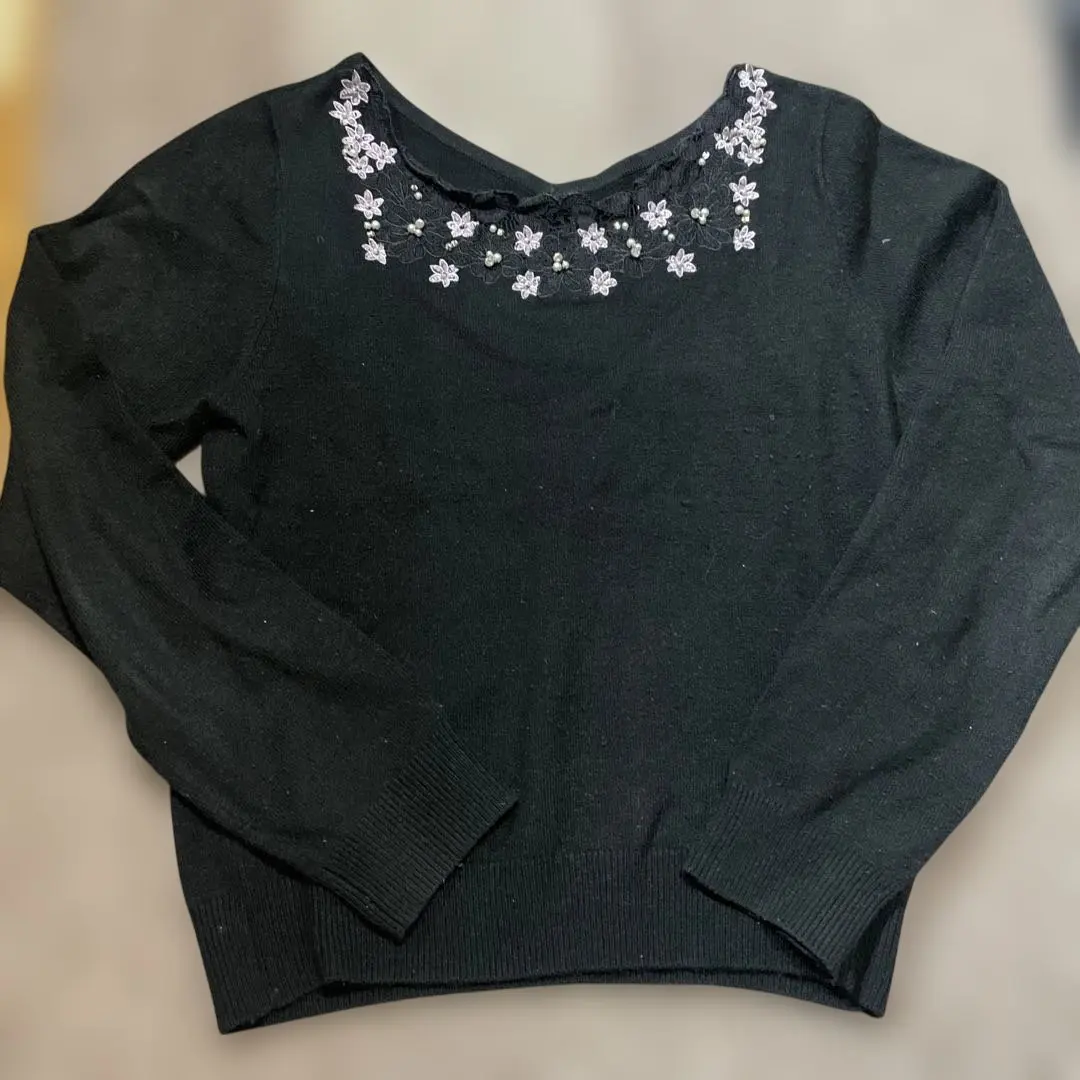 Thumbnail of Black long-sleeved knit sweater with floral embroidery and pearl embellishments, size M