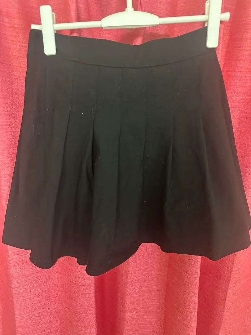 Thumbnail of Black pleated mini skirt