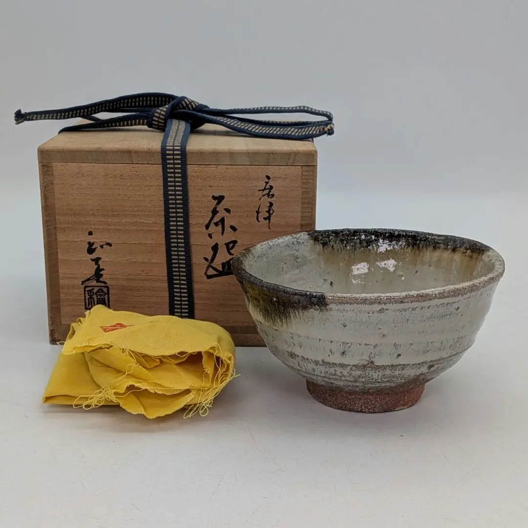 Thumbnail of Karatsu-yaki tea bowl, square-sided, with wooden box (kyobako) and cloth (kyonuno). Matcha bowl, tea ceremony utensil, tea ware, tableware. With inscription.