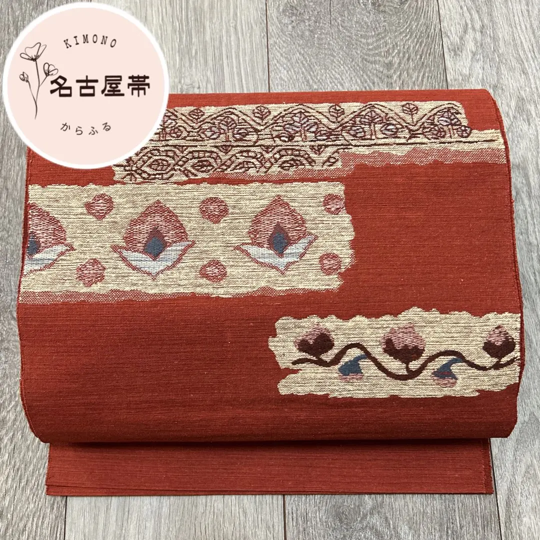 Thumbnail of Hassun Obi (8-sun width obi) / Hassun Nagoya Obi / Hiraki-Jitate (open-weave construction) / Shakudoiro (red-brown color) / Floral Pattern / Taiko (drum) Pattern / Silk / 18